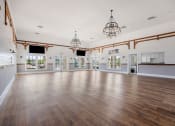 Thumbnail 17 of 29 - the spacious dance room with wood floors and chandeliers