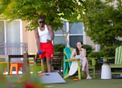 Thumbnail 11 of 60 - a man and a woman playing a game of ping pong at Proximity at ODU in Norfolk, Virginia