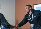 Thumbnail 53 of 60 - a man shaking another mans hand at a networking event at Proximity at ODU in VA 23508