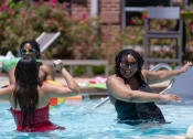 Thumbnail 2 of 60 - a group of women in a pool playing in the water at Proximity at ODU in Norfolk, VA