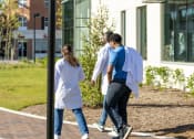 Thumbnail 59 of 60 - a group of people walking outside of a building at Proximity at ODU in Virginia 23508