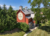 Thumbnail 1 of 9 - a red barn with the bar on the side of it