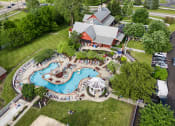 Thumbnail 2 of 9 - an overhead view of a resort style swimming pool with a pavilion