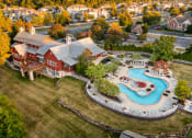 Thumbnail 3 of 9 - an aerial view of a swimming pool in front of a house