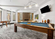 Thumbnail 8 of 55 - a games room with a pool table and a television at The Lincoln in Raleigh, North Carolina
