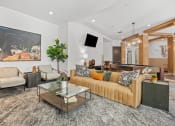 Thumbnail 6 of 55 - a living room with a couch and a coffee table at The Lincoln in Raleigh, North Carolina 27601