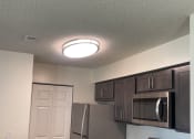 Thumbnail 50 of 78 - a kitchen with granite counter tops and stainless steel appliances