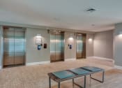Thumbnail 8 of 53 - a large room with elevators and a table in the middleat The View at Blue Ridge Commons Apartments, Roanoke, VA