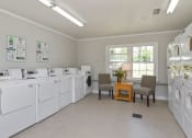Thumbnail 9 of 27 - laundry room at Tryon Village