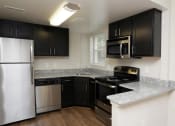 Thumbnail 9 of 16 - Woodbury Park Apartments kitchen