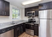 Thumbnail 8 of 16 - Woodbury Park Apartments kitchen