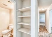 Thumbnail 5 of 24 - a bathroom with a toilet and some shelves in it at Gates of West Bay, Norfolk, VA 23503