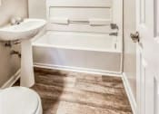 Thumbnail 14 of 24 - a bathroom with a sink and a bath tub at Gates of West Bay, Norfolk, 23503