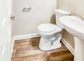 Thumbnail 15 of 24 - a bathroom with a toilet and a sink at Gates of West Bay, Norfolk Virginia