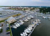 Thumbnail 2 of 47 - a marina filled with lots of white boats at The Port at East Beach Apartments and Marina, Norkfolk, VA, 23518