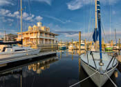 Thumbnail 9 of 47 - marina with Longboards restaurant in background at The Port at East Beach Apartments and Marina, Norkfolk, VA