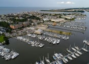 Thumbnail 1 of 47 - a marina full of boats sitting in the water at The Port at East Beach Apartments and Marina, Virginia, 23518