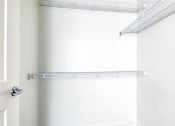 Thumbnail 29 of 47 - an empty closet with a white wall and a white door at The Port at East Beach Apartments and Marina, Norkfolk, 23518