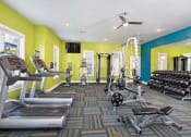 Thumbnail 15 of 32 - Equipped Fitness Center at Addison Crater Woods, Petersburg, VA 23805