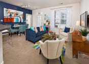 Thumbnail 5 of 32 - a living room with blue walls and white furniture at Addison Crater Woods, Virginia
