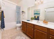 Thumbnail 9 of 32 - a bathroom with a toilet sink and bathtub at Addison Crater Woods, Petersburg, VA 23805