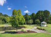 Thumbnail 29 of 32 - a park with a pond and gazebo at Addison Crater Woods, Virginia