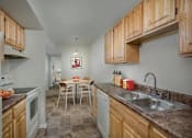 Thumbnail 1 of 21 - a kitchen with a sink and a table