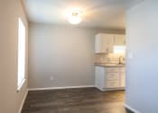 Thumbnail 11 of 16 - a kitchen and dining area in a 555 waverly unit