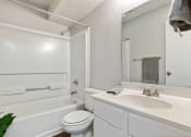 Thumbnail 18 of 43 - a white bathroom with a sink and a toile at Village 1373, Greensboro, NC