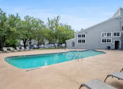 Thumbnail 36 of 43 - a swimming pool at the resort on a sunny dayat Village 1373, Greensboro North Carolina