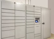 Thumbnail 27 of 40 - A row of LUXER branded lockers are lined up in a room.