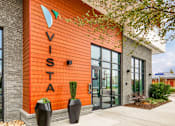 Thumbnail 3 of 40 - A building with a sign that says Vista on it.