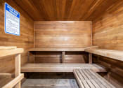 Thumbnail 6 of 44 - an empty sauna with wooden benches at Wendover River Oaks, Greensboro