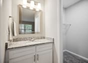 Thumbnail 18 of 44 - a bathroom with a sink and a mirror at Wendover River Oaks, Greensboro
