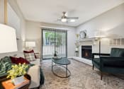 Thumbnail 14 of 44 - our apartments offer a living room with a fireplace at Wendover River Oaks, North Carolina