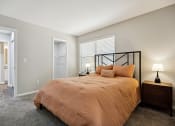 Thumbnail 15 of 44 - a bedroom with a bed and two night stands at Wendover River Oaks, Greensboro, North Carolina