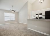 Thumbnail 25 of 44 - a bedroom with a large window and a ceiling fan at Wendover River Oaks, Greensboro, 27409