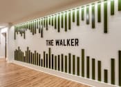 Thumbnail 38 of 40 - A wall with bars and the words "The Walker" on it.
