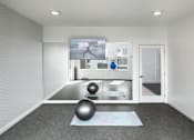 Thumbnail 13 of 42 - A room with a yoga mat and two exercise balls on the floor.