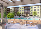 Thumbnail 23 of 44 - a pool with chairs and tables in front of an apartment building at Boardwalk at Research Park, Huntsville, AL, 35811