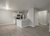 Thumbnail 9 of 13 - A kitchen with white cabinets and a microwave above the stove.