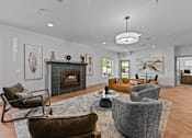 Thumbnail 16 of 25 - A modern living room with a fireplace and comfortable seating.