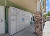 Thumbnail 12 of 25 - A row of white refrigerators are lined up outside a green building.