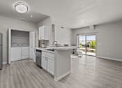 Thumbnail 8 of 25 - A modern kitchen with white cabinets and appliances.