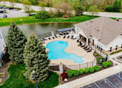 Thumbnail 35 of 36 - A large house with a pool in the backyard.