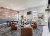 Thumbnail 5 of 21 - A modern living room with a grey carpet and a large painting on the wall.