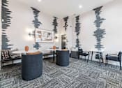 Thumbnail 9 of 21 - A room with a grey carpet and a grey and black abstract wallpaper.
