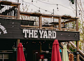 Thumbnail 35 of 42 - The Yard is a restaurant with outdoor seating.