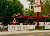 Thumbnail 42 of 42 - A restaurant with a red and white sign that says "The Suds".