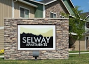 Thumbnail 23 of 25 - A sign for Selway Apartments is displayed in front of a building.